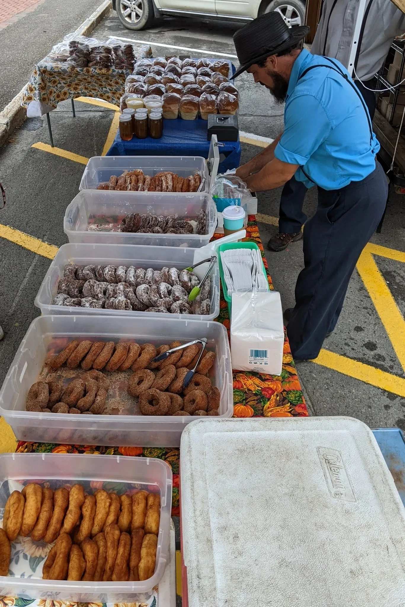 Beechy's Bakery Amish market stand with fresh donuts, breads and jars of pickles