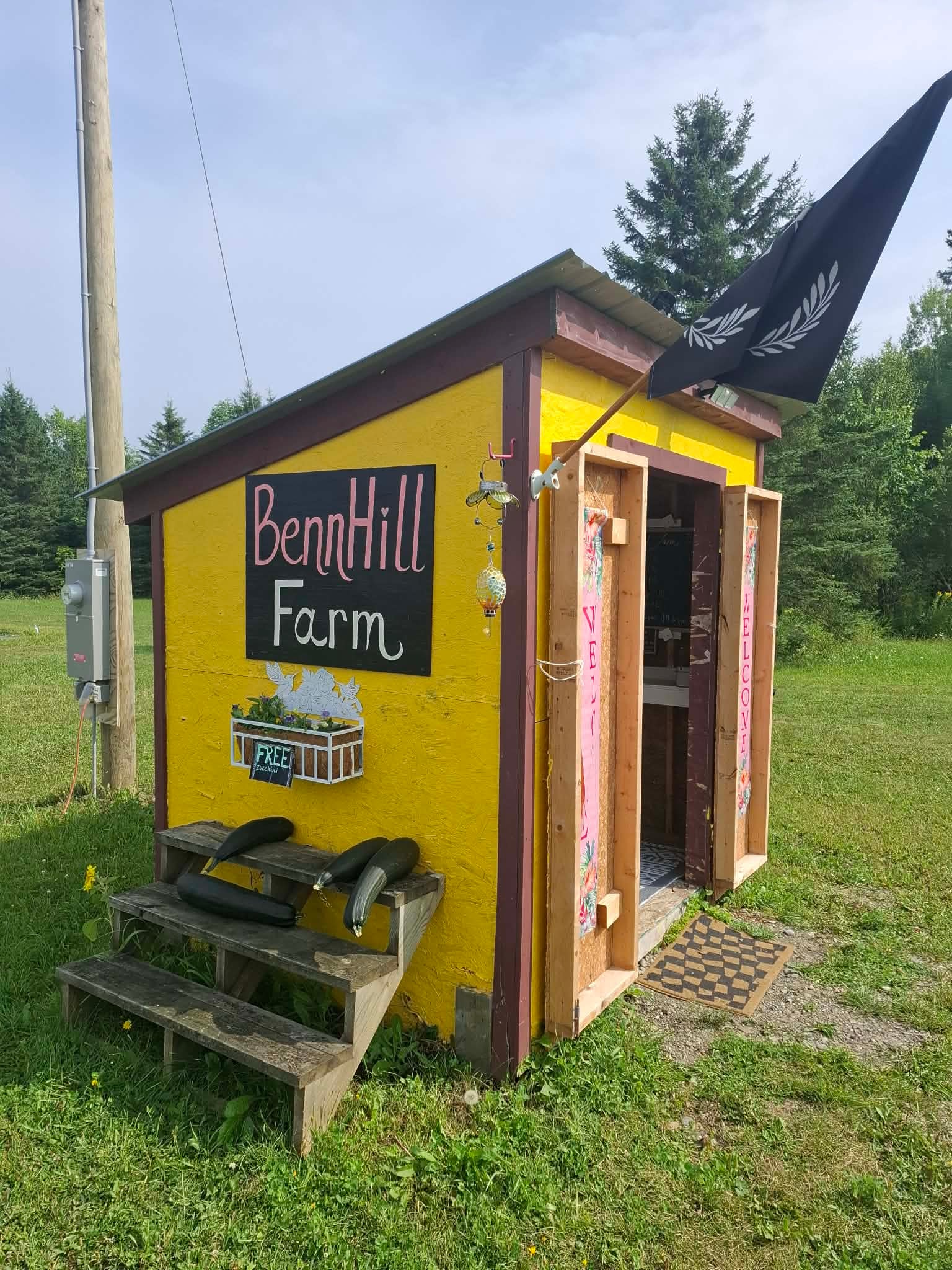 Bright yellow Benn Hill Farm roadside stand on Benn Hill Road