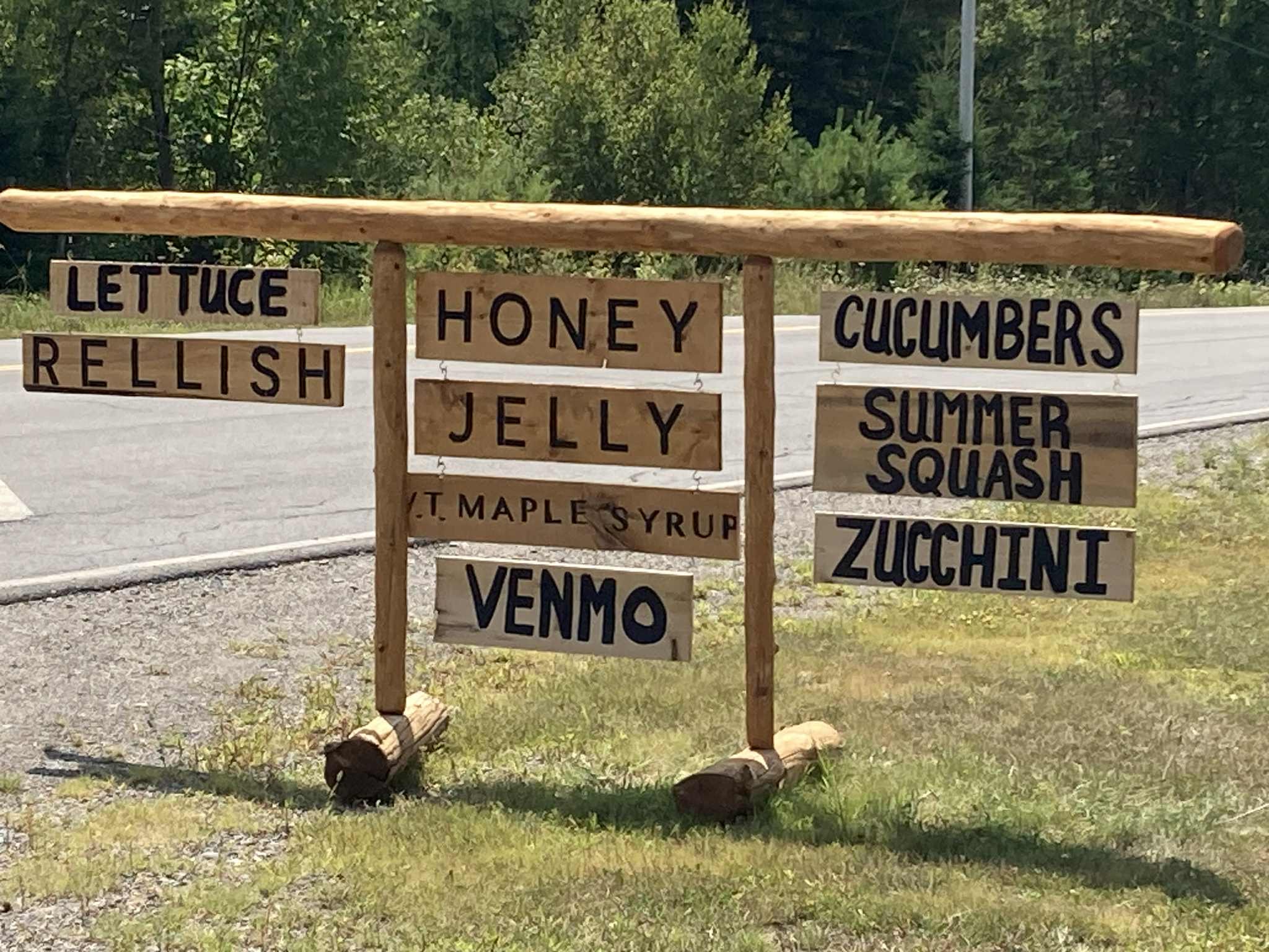 Honey on the Hill roadside stand sign in Haynesville, Maine