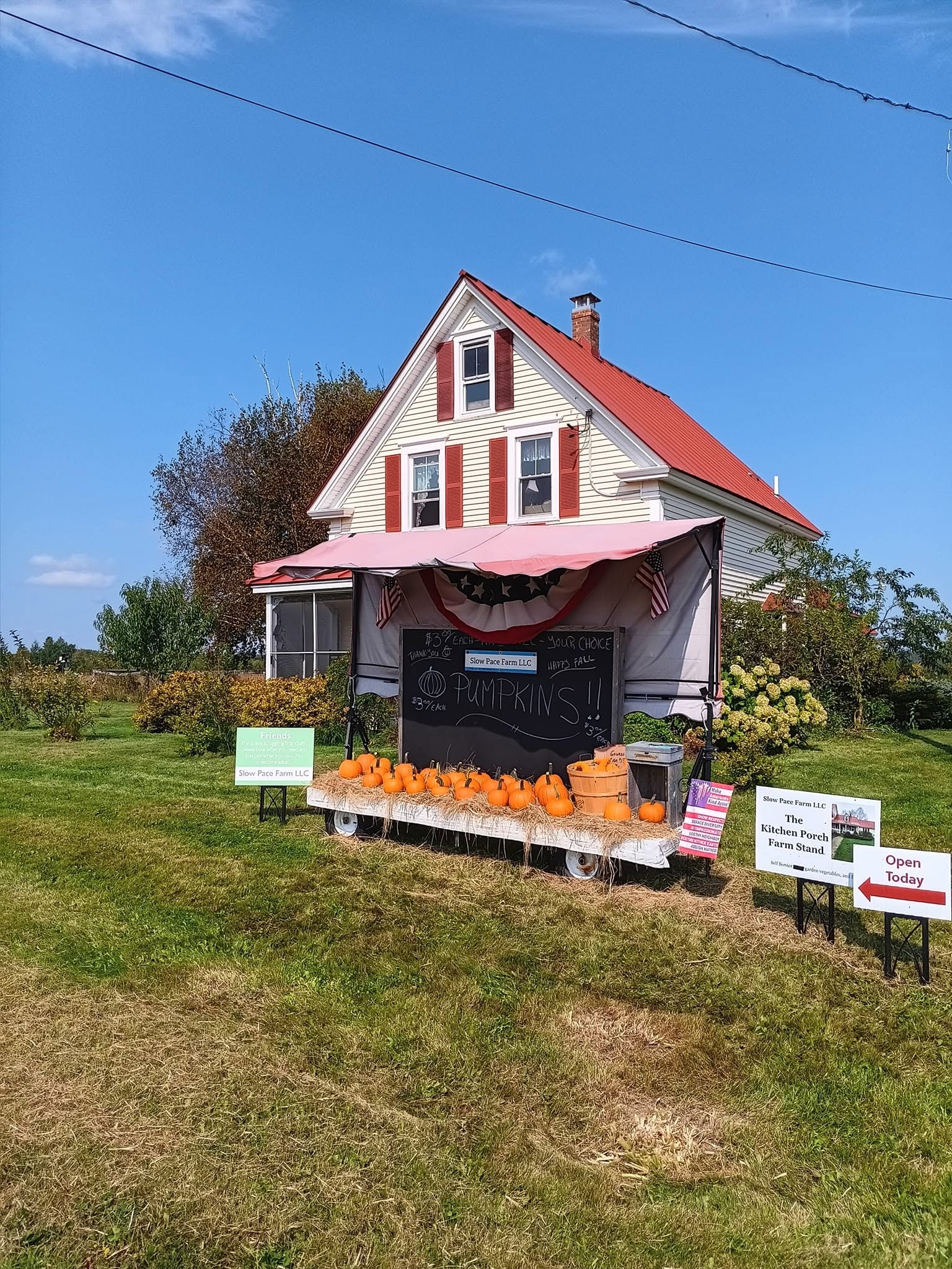 Slow Pace Farm’s seasonal pumpkin stand outside the farmhouse in Monticello