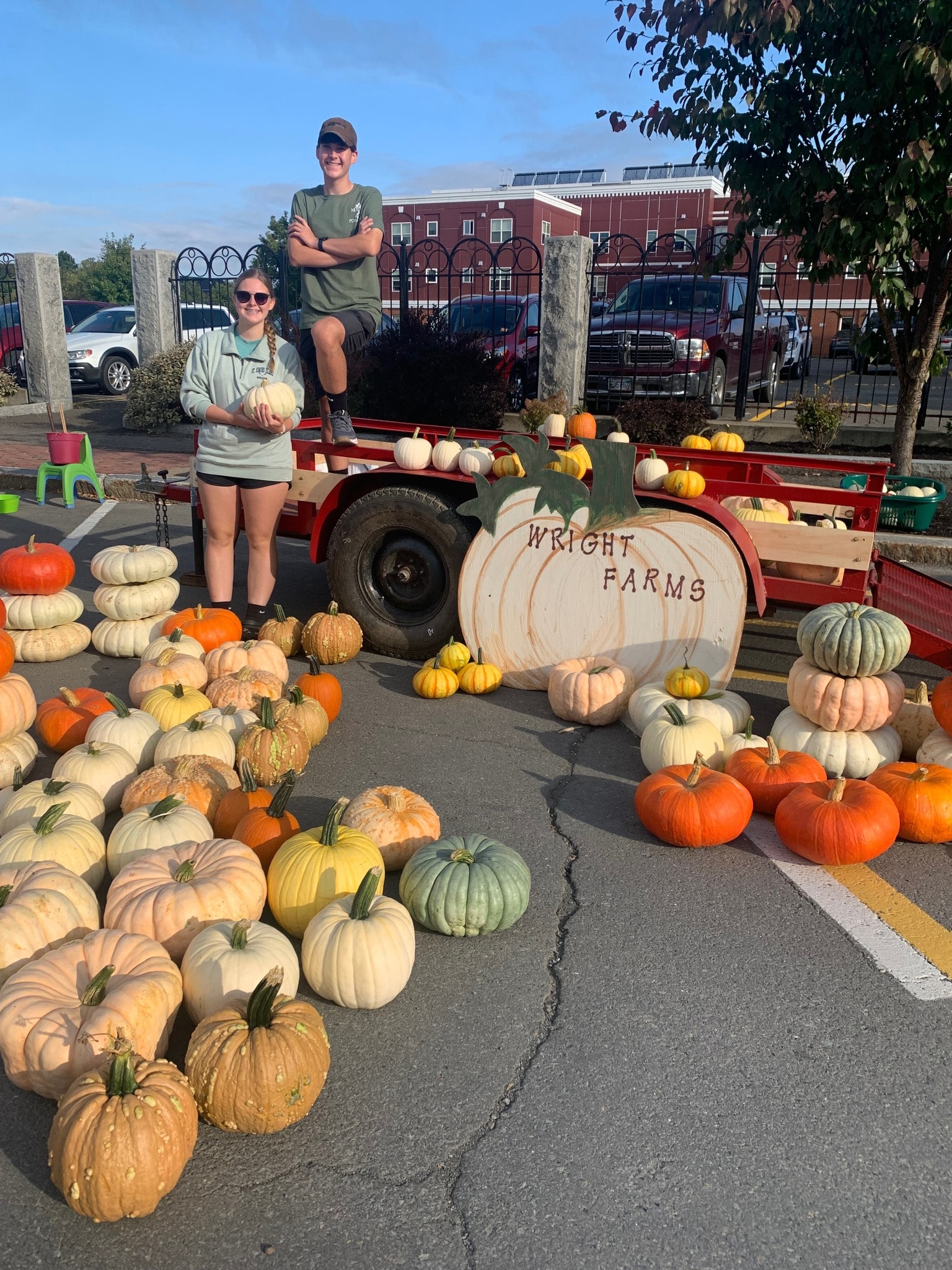 Ryan and Reagan Wright with their colorful pumpkin and squash display at the Houlton Community Market